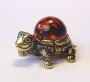 Фигурка из латуни с янтарем Черепаха с шаром арт. 1355
